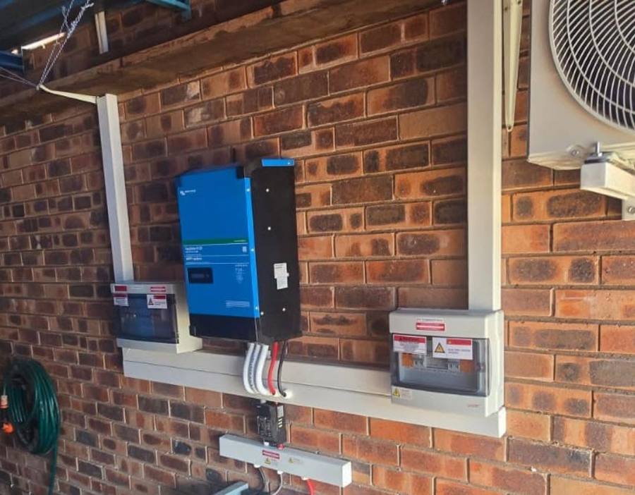 Inverter and distribution box on a brick wall